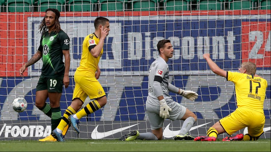 Raphael Guerreiro celebrates his goal against Wolfsburg