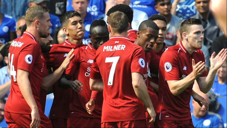 Liverpool players celebrate after scoring against Leicester