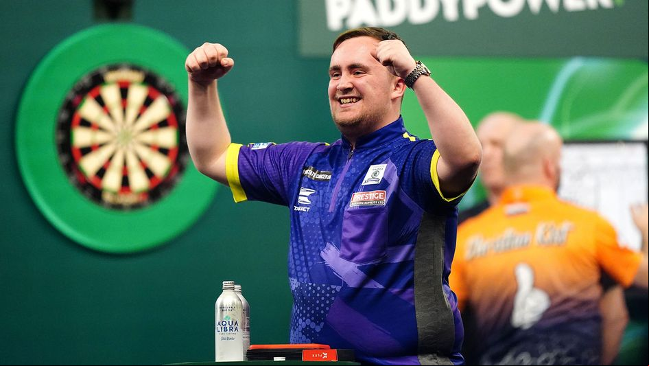 Luke Littler celebrates on his PDC World Championship debut