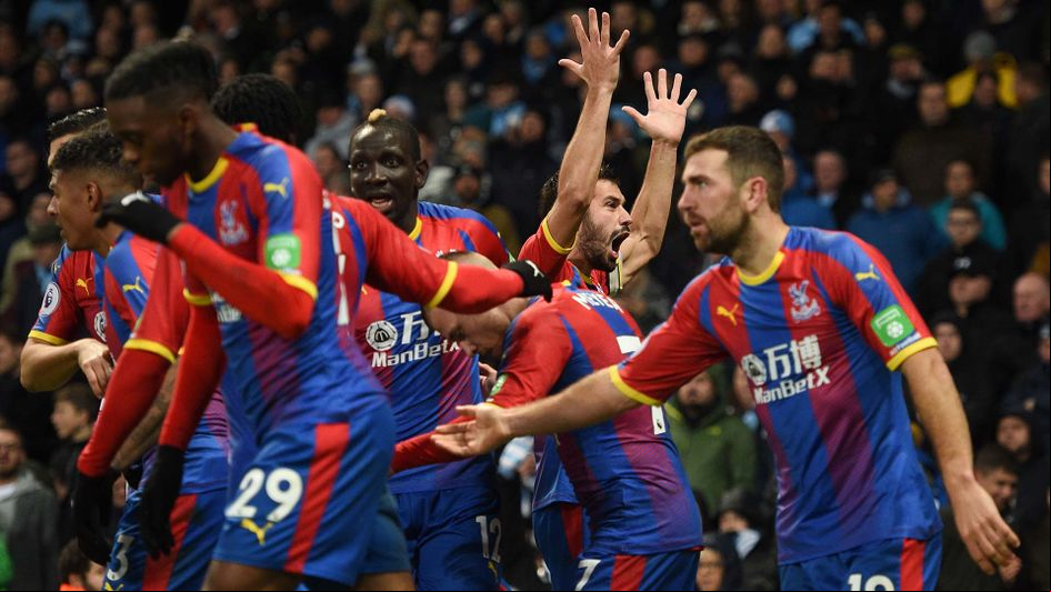 Luka Milivojevic celebrates scoring for Crystal Palace at Manchester City