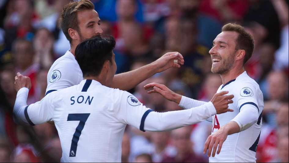 Tottenham celebrate Christian Eriksen's (right) goal in the north London derby at Arsenal