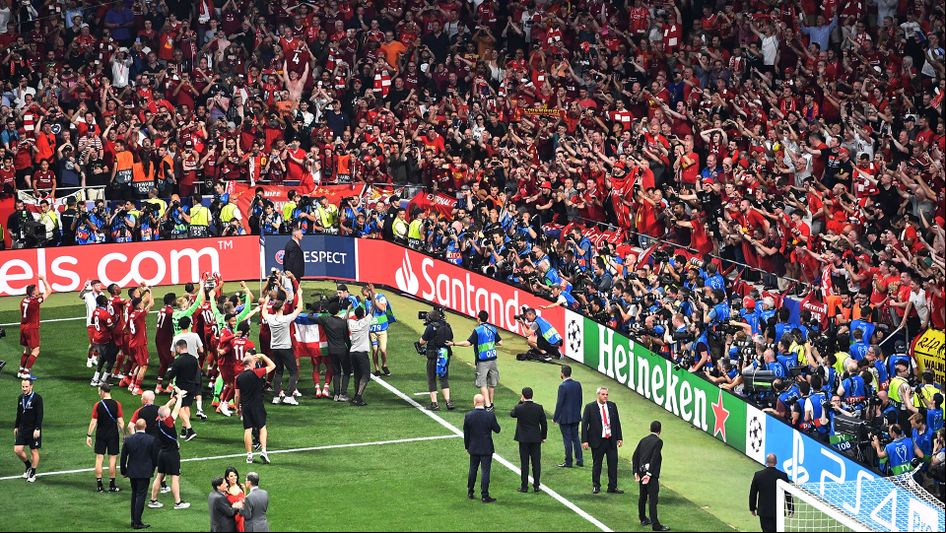 Liverpool celebrate winning the Champions League in front of their ers