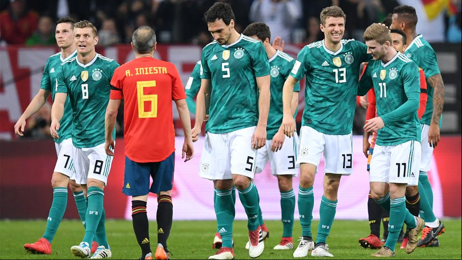 Thomas Muller and celebrate after scoring against Spain