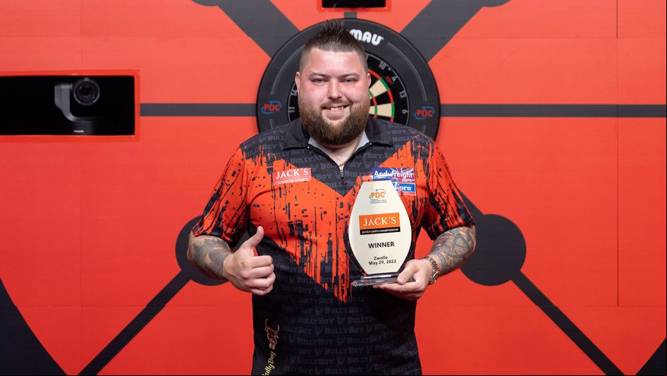 Michael Smith celebrates victory