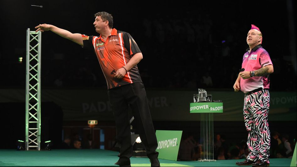 Mensur Suljovic in action against Peter Wright (Picture: PDC/Chris Deam)