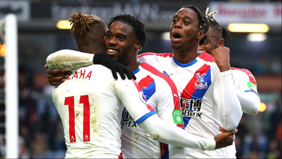 Crystal Palace players celebrate with Wilfried Zaha at Burnley